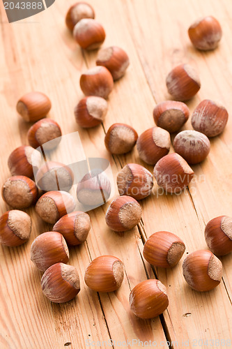 Image of hazelnuts on wooden table