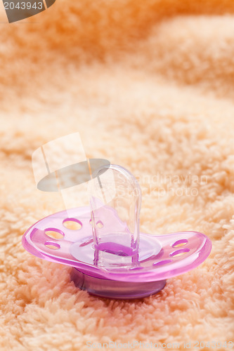 Image of the pacifier on soft background
