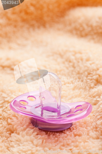 Image of the pacifier on soft background