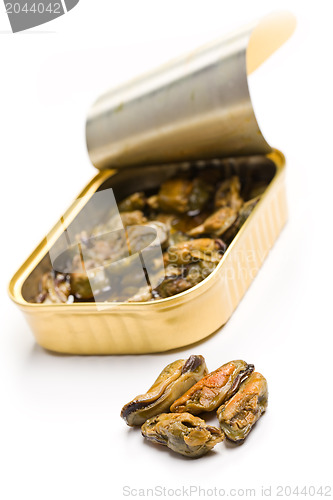 Image of smoked mussels in opened tin can