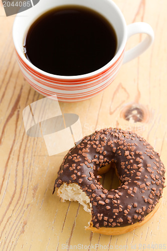 Image of doughnut with black coffee