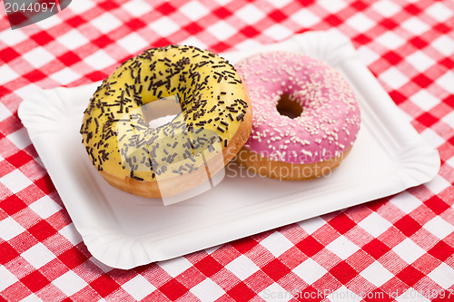 Image of sweet doughnuts on paper plate