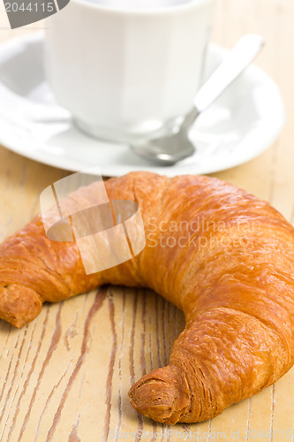 Image of fresh croissant with coffee