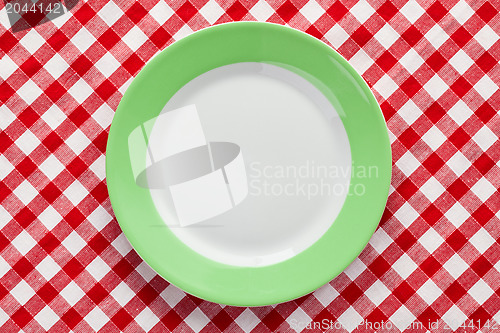 Image of green plate on checkered tablecloth