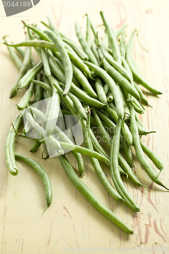 Image of bean pods on wooden table