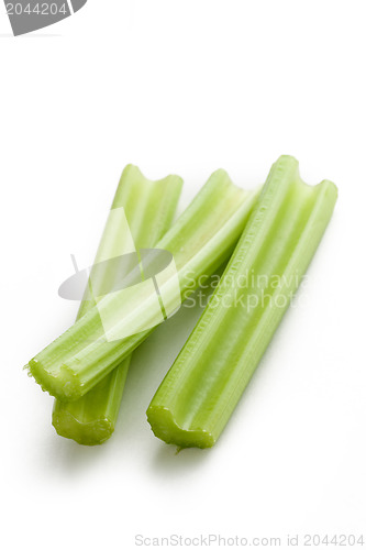 Image of green celery sticks on white background