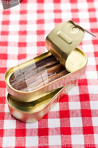 Image of anchovies fillets in tin can