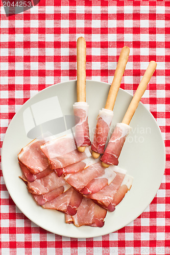 Image of grissini sticks with ham