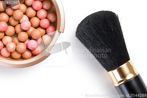 Image of bronzing pearls and makeup brush