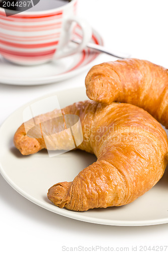 Image of fresh croissant with coffee