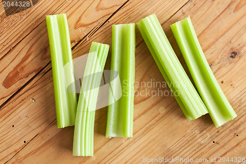 Image of green celery sticks on kitchen table