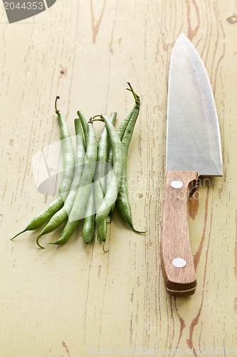 Image of bean pods with knife