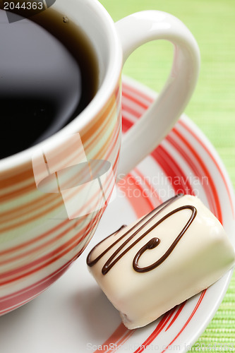 Image of chocolate praline and coffee cup