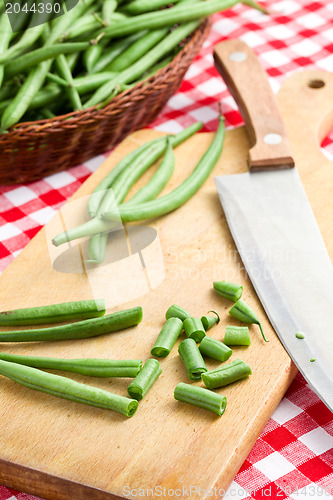 Image of bean pods with knife