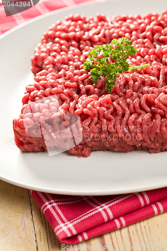Image of raw minced meat on kitchen table