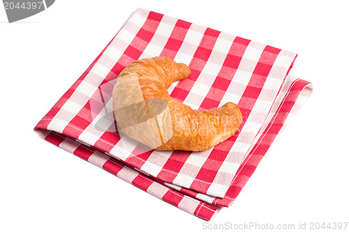 Image of fresh croissants on checkered napkin