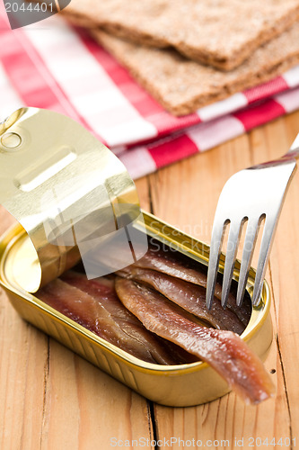 Image of anchovies fillets in tin can