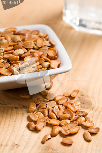 Image of roasted soya beans on wooden table