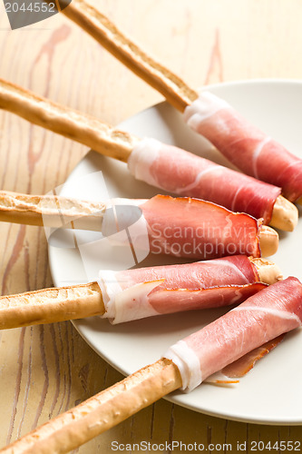 Image of grissini sticks with ham