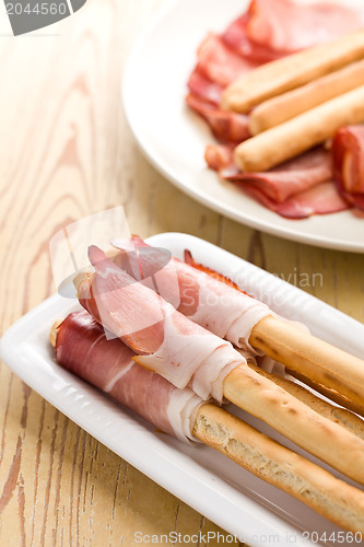 Image of grissini sticks with ham