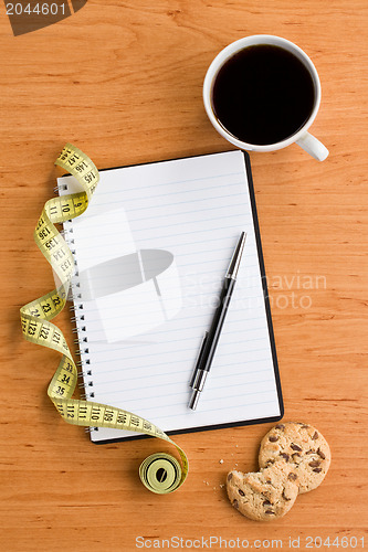 Image of diet concept : notebook and cookies