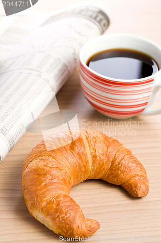 Image of breakfast with newspaper