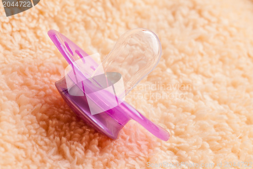 Image of the pacifier on soft background