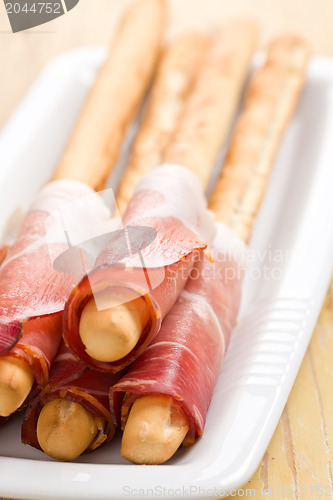 Image of grissini sticks with ham