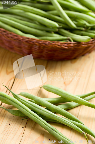 Image of bean pods on wooden table