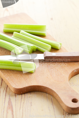 Image of green celery sticks on kitchen table