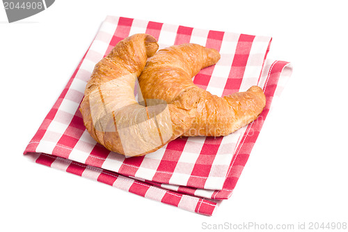 Image of fresh croissants on checkered napkin