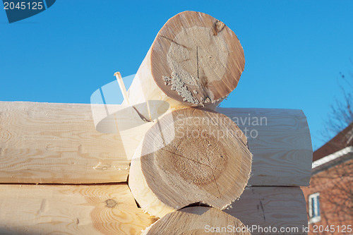 Image of Frame house built of pine logs