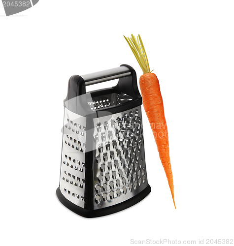 Image of carrot on grater on white background