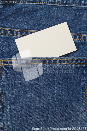 Image of A denium blue jean pocket witn business card