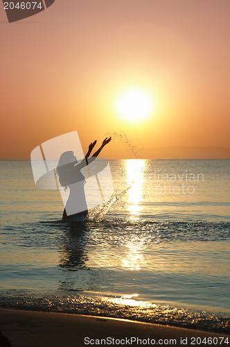 Image of Woman at sunset