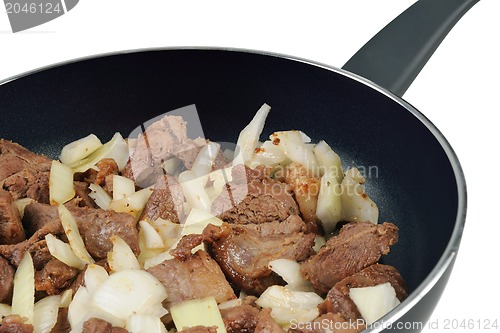 Image of Roasting pan with Meat and onion.