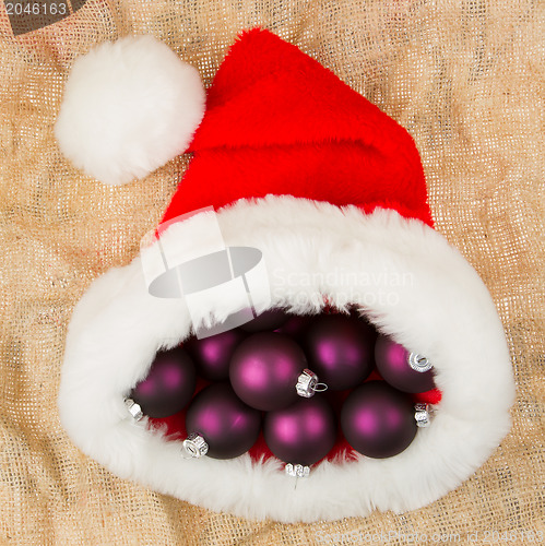 Image of Santas hat filled with Christmas balls