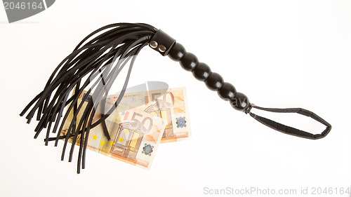 Image of Kinky and fetish whip and 100 euro isolated on white background