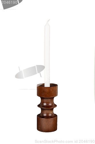 Image of Old antique wooden candlestick candleholder with vintage candle