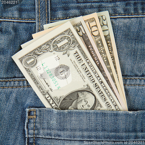 Image of Macro shot of trendy jeans with american four different dollar b