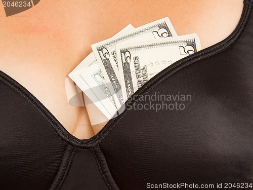 Image of Concept - woman with cash in a bra