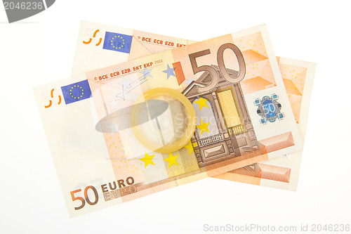 Image of Condom on two 50 euro bills