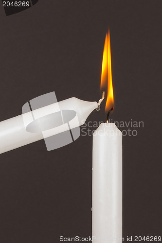 Image of Burning white candle, isolated