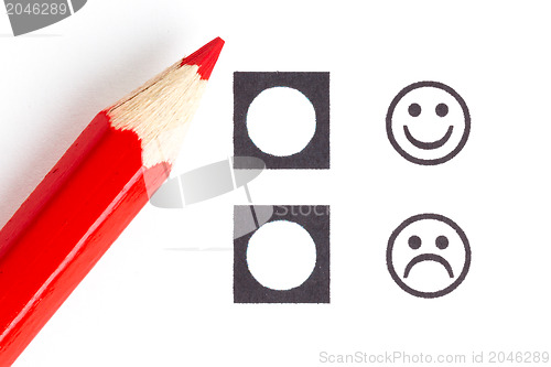 Image of Red pencil choosing the right smiley