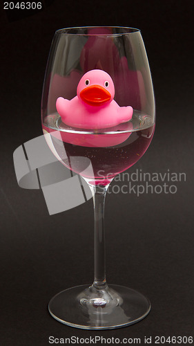 Image of Pink rubber duck in a wineglass