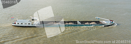 Image of Ship with loose cargo sailing in the port of Rotterdam (Holland)