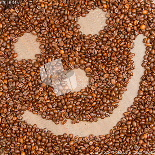 Image of Coffee grains arranged in smiley