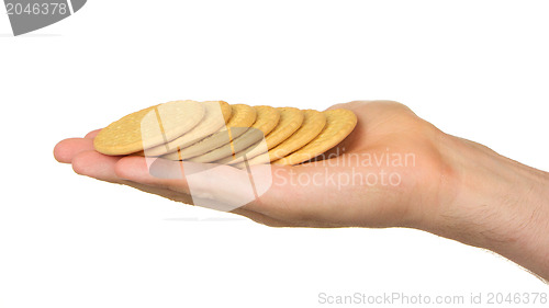 Image of Man with a hand full of biscuits