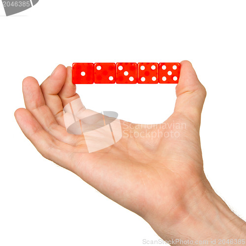 Image of Man holding five red dice