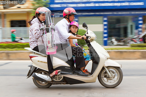 Image of DONG HOI, VIETNAM, 7 AUGUST 2012 - Complete Vietnamese family wi